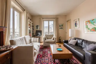 Coin salon dans l'établissement Veeve - Quai aux Fleurs Apartment