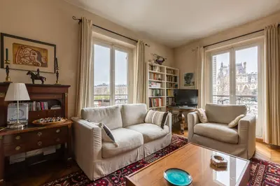 Coin salon dans l'établissement Veeve - Quai aux Fleurs Apartment