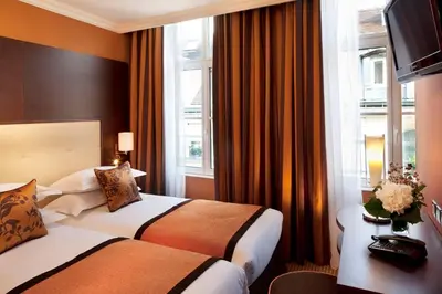 Un ou plusieurs lits dans un hébergement de l'établissement Hôtel 85 Saint Honore