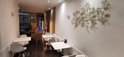 Coin salon dans l'établissement Hôtel du Maine