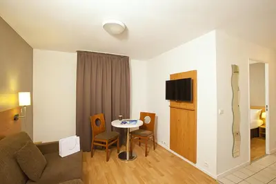 Télévision ou salle de divertissement dans l'établissement Séjours & Affaires Paris Ivry