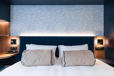 Un ou plusieurs lits dans un hébergement de l'établissement Hotel Bleu de Grenelle - Tour Eiffel