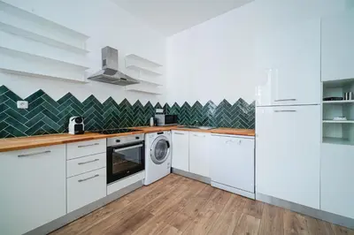 Cuisine ou kitchenette dans l'établissement Parisuites Central Canal Saint Martin Design & Luxe & Cosy