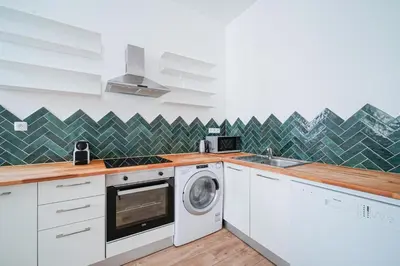 Cuisine ou kitchenette dans l'établissement Parisuites Central Canal Saint Martin Design & Luxe & Cosy