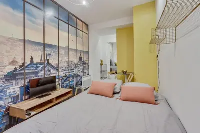 Un ou plusieurs lits dans un hébergement de l'établissement 143 Suite La Française Superbe Appartement à Paris