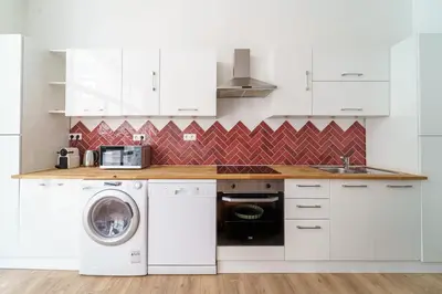 Cuisine ou kitchenette dans l'établissement Parisuites Central Canal Saint Martin Chic & Design & Cosy