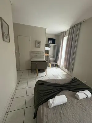 Un ou plusieurs lits dans un hébergement de l'établissement HOTEL DU MONT LOUIS