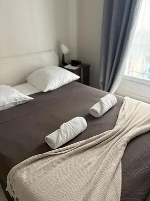 Un ou plusieurs lits dans un hébergement de l'établissement HOTEL DU MONT LOUIS