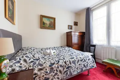 Un ou plusieurs lits dans un hébergement de l'établissement GuestReady - Apt fonctionnel situé dansl e 15ème