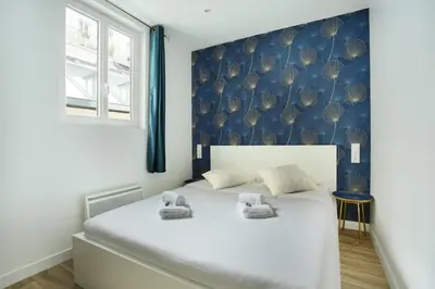 Un ou plusieurs lits dans un hébergement de l'établissement Rent a Room - Cosy 1BDR
