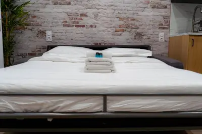Un ou plusieurs lits dans un hébergement de l'établissement Rent a Room - Cosy 1BDR