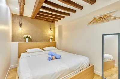 Un ou plusieurs lits dans un hébergement de l'établissement Rent a Room - Cosy 2BDR