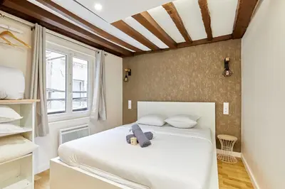 Un ou plusieurs lits dans un hébergement de l'établissement Rent a Room - Cosy 2BDR