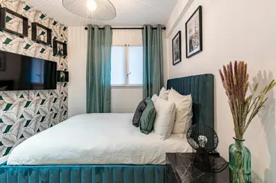 Un ou plusieurs lits dans un hébergement de l'établissement Le Studio Du Parc Monceau
