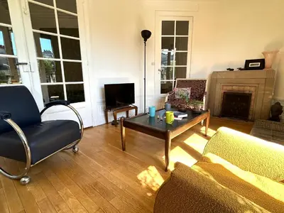 Coin salon dans l'établissement Le Penthouse Guy Moquet