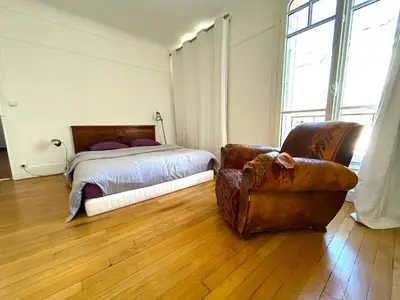 Un ou plusieurs lits dans un hébergement de l'établissement Le Penthouse Guy Moquet
