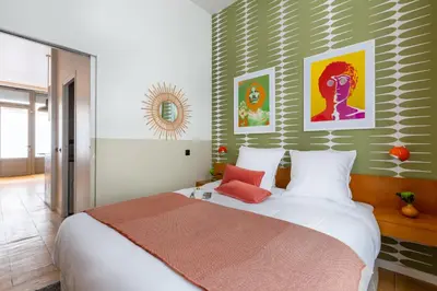 Un ou plusieurs lits dans un hébergement de l'établissement Boutik Boheme Le Loft Batignolles
