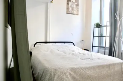 Un ou plusieurs lits dans un hébergement de l'établissement Atypical Apartment - Jardin Des Plantes