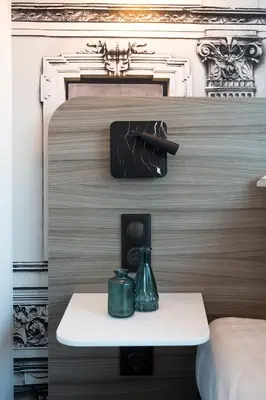 Un ou plusieurs lits dans un hébergement de l'établissement Nemea Appart Hotel Paris Levallois