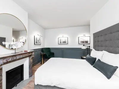 Un ou plusieurs lits dans un hébergement de l'établissement LivinParis - Luxury 2 Bedrooms Opera VI