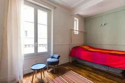 Un ou plusieurs lits dans un hébergement de l'établissement Studio I love Montmartre