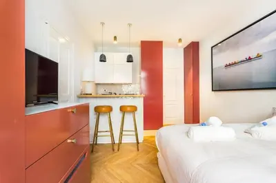 Un ou plusieurs lits dans un hébergement de l'établissement Appartement Studio Trocadéro
