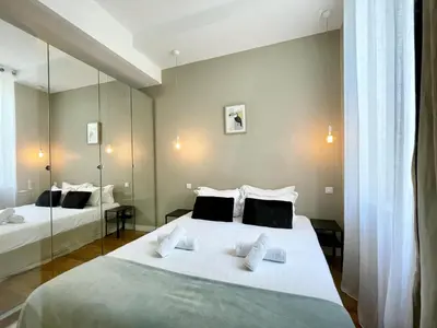 Un ou plusieurs lits dans un hébergement de l'établissement PARISIAN HOME l BELLAN