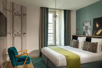 Un ou plusieurs lits dans un hébergement de l'établissement Lyric Hotel Paris Opera