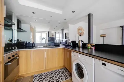 Cuisine ou kitchenette dans l'établissement Les appartements de l'atelier Paris 3