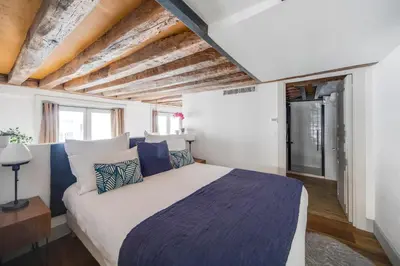 Un ou plusieurs lits dans un hébergement de l'établissement Les appartements de l'atelier Paris 3