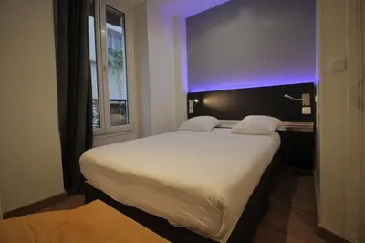 Un ou plusieurs lits dans un hébergement de l'établissement Modern's Hotel