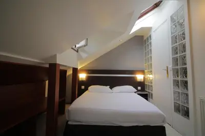 Un ou plusieurs lits dans un hébergement de l'établissement Modern's Hotel