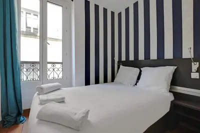 Un ou plusieurs lits dans un hébergement de l'établissement Modern's Hotel