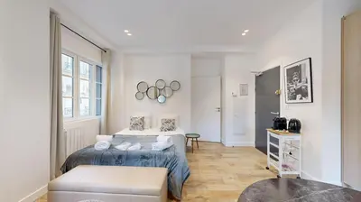 Un ou plusieurs lits dans un hébergement de l'établissement 151 Suite Jean Yves - Superbe Studio à Paris