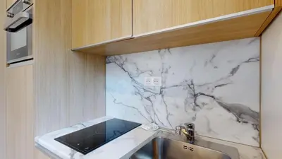 Cuisine ou kitchenette dans l'établissement 151 Suite Jean Yves - Superbe Studio à Paris