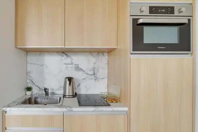 Cuisine ou kitchenette dans l'établissement 155 Suite Georges - Superbe Appartement à Paris