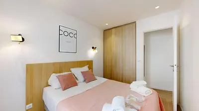 Un ou plusieurs lits dans un hébergement de l'établissement 155 Suite Georges - Superbe Appartement à Paris