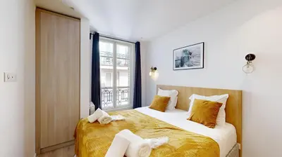Un ou plusieurs lits dans un hébergement de l'établissement 158 Suite Jeremy - Superbe Appartement à Paris