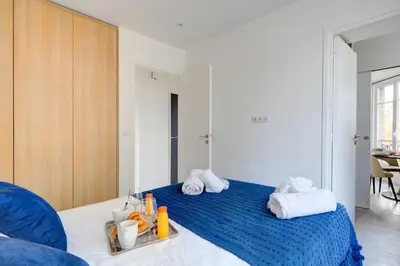 Un ou plusieurs lits dans un hébergement de l'établissement 159 Suite Margot - Superbe Appartement à Paris