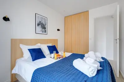 Un ou plusieurs lits dans un hébergement de l'établissement 159 Suite Margot - Superbe Appartement à Paris