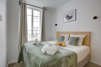Un ou plusieurs lits dans un hébergement de l'établissement 160 Suite Eve - Superbe Appartement à Paris