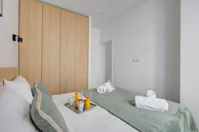 Un ou plusieurs lits dans un hébergement de l'établissement 160 Suite Eve - Superbe Appartement à Paris