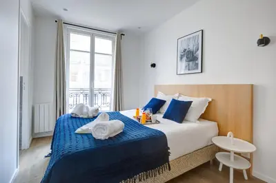 Un ou plusieurs lits dans un hébergement de l'établissement 161 Suite Raphael - Superbe Appartement à Paris