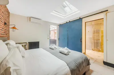 Un ou plusieurs lits dans un hébergement de l'établissement Les appartements de l'atelier Paris 15