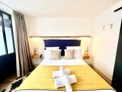 Un ou plusieurs lits dans un hébergement de l'établissement Les appartements de l'atelier Paris 15