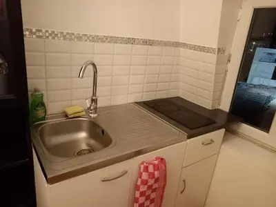 Cuisine ou kitchenette dans l'établissement 3 Hebergements à 5 minutes de Paris et 30 MN Stade de France