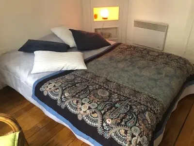 Un ou plusieurs lits dans un hébergement de l'établissement Appartement Opéra Paris