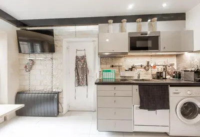 Cuisine ou kitchenette dans l'établissement Studio a Paris et désinfection rigoureux du logis