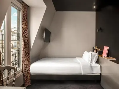 Un ou plusieurs lits dans un hébergement de l'établissement Grand Hotel Lafayette