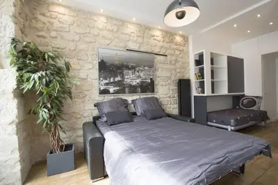 Un ou plusieurs lits dans un hébergement de l'établissement The Designer Apartment